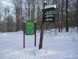Art Roscoe Trail sign with map and trail post